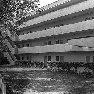 Black-and-white photograph of apartment building